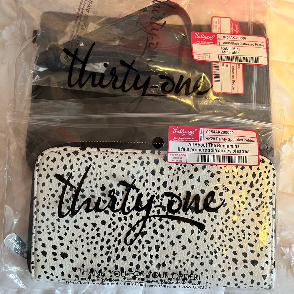 Thirty-One speckled Clutch Wallet and black Clutch Bag. New in original bags.